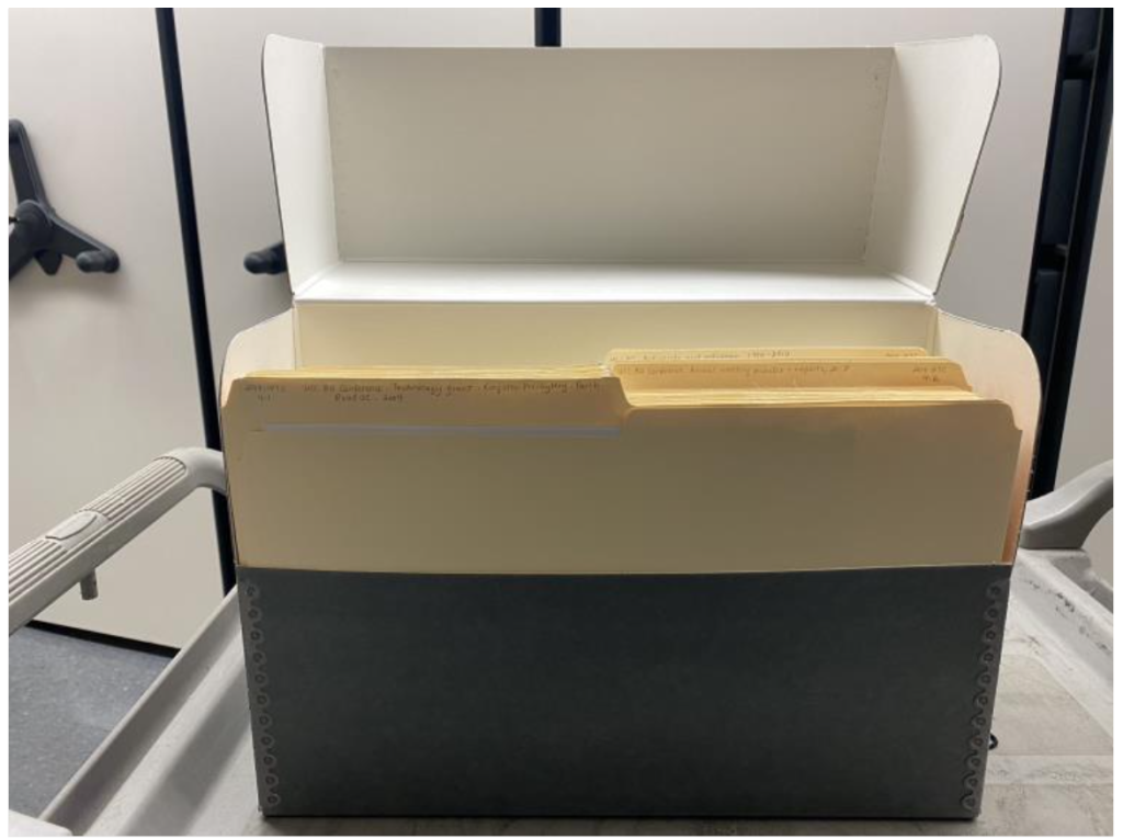 Processed box of archival records. Records are labelled and place in acid free folders within a special acid free archival box.