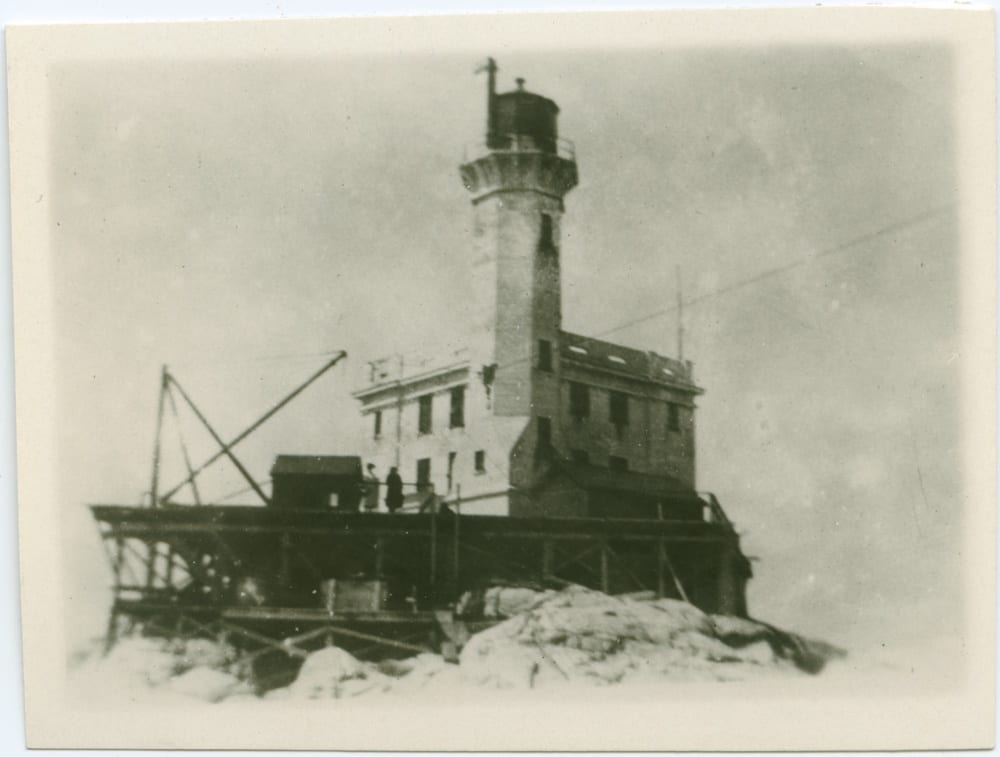 Lighthouse with rocks in the front